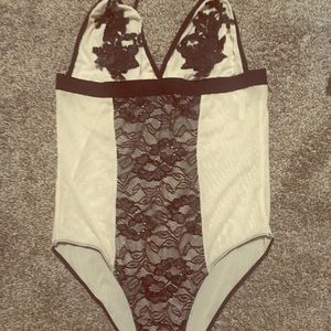 Flora nude and black Bodysuit